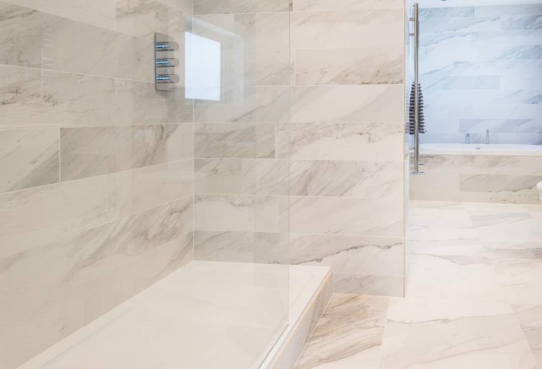 The huge shower with rainfall shower head.