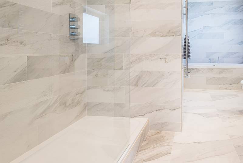 The huge walk-in shower with rainfall shower head.