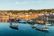 The pretty fishing village of Mousehole, a traditional fishing village full of smugglers tales.