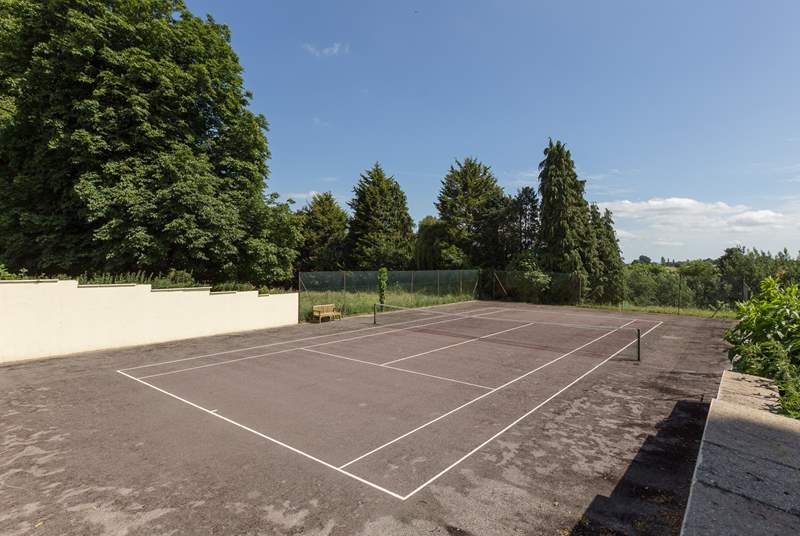 This cottage, and Orchard Barn next door, also have this shared tennis court to enjoy.