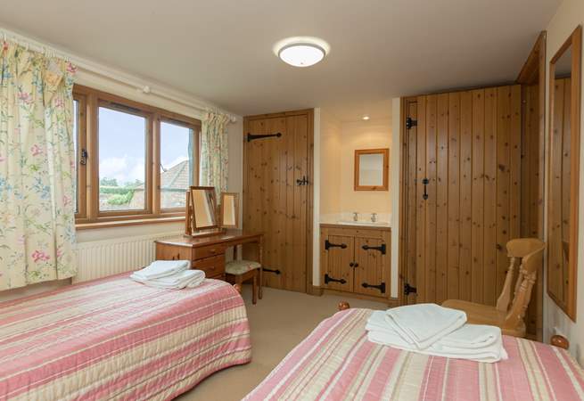 Another view of the twin bedroom which offers plenty of space for adults or children.