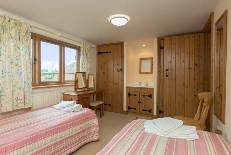 Another view of the twin bedroom which offers plenty of space for adults or children.