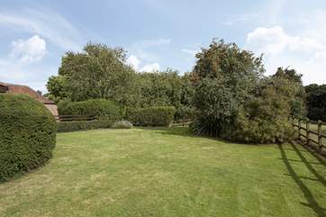 This is the lovely, very large, enclosed garden. It overlooks the paddock and the tennis court beyond.