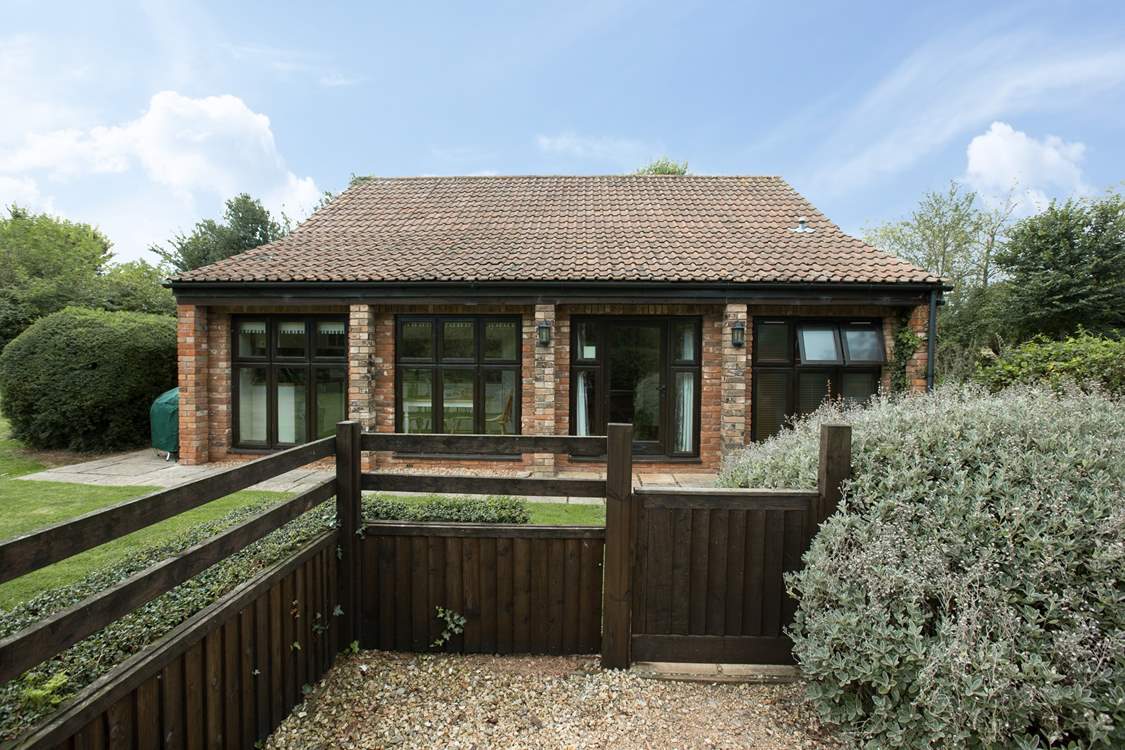 This is the side view of the cottage. You can park close to the gate.