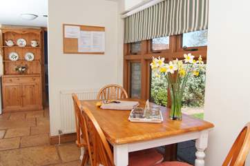 There is a bright and cheerful kitchen off the entrance hall
