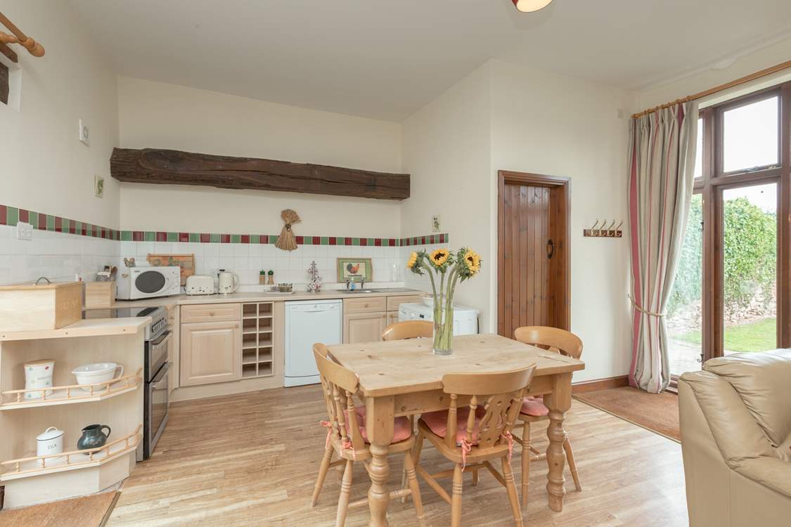 The cottage has a light and bright kitchen/dining area - the living space is all open plan with French windows to the garden.