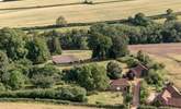 To give a sense of scale, the grounds spread out behind and to the right of Orchard Barn with a view of the tennis court in the distance... - Thumbnail Image