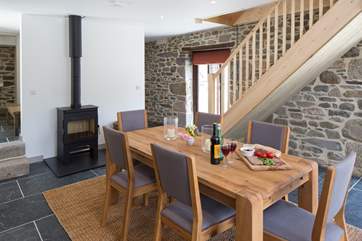 A hand made wooden staircase goes up to the bedrooms above