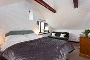 Enjoy a deep slumber in the main bedroom.
