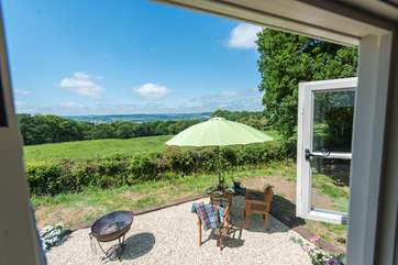 Sat right in the meadow to take advantage of the views, there is a patio-area with fire-pit barbecue, table and chairs.