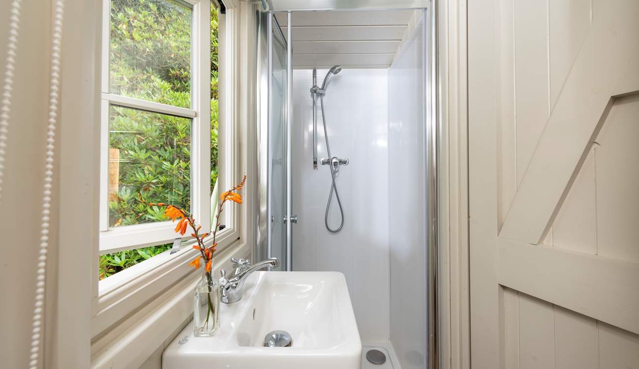 The ensuite shower room is perfect for freshening up after the day's adventures. 