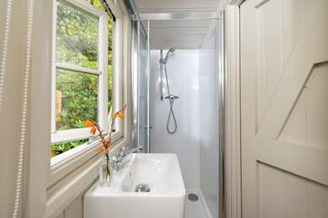 Complete with wash-basin, WC and shower cubicle.