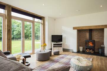 A cosy and funky wood-burner sits in the inglenook fireplace, although you probably won't need it for heat in this highly insulated eco-house.