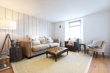 The sitting-room also looks out towards the water.
