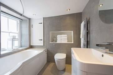 Contemporary bathroom fittings contrast beautifully with the old cottage.