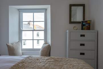 A window seat looks out towards the bay.