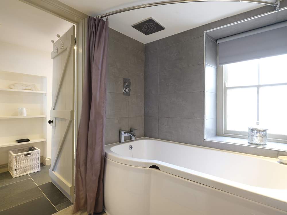 The bathroom is on the ground floor (there's limited headroom standing in the bath so the fitted shower will not be suitable for all).