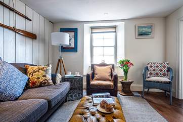 The sitting-room also looks out towards the water.