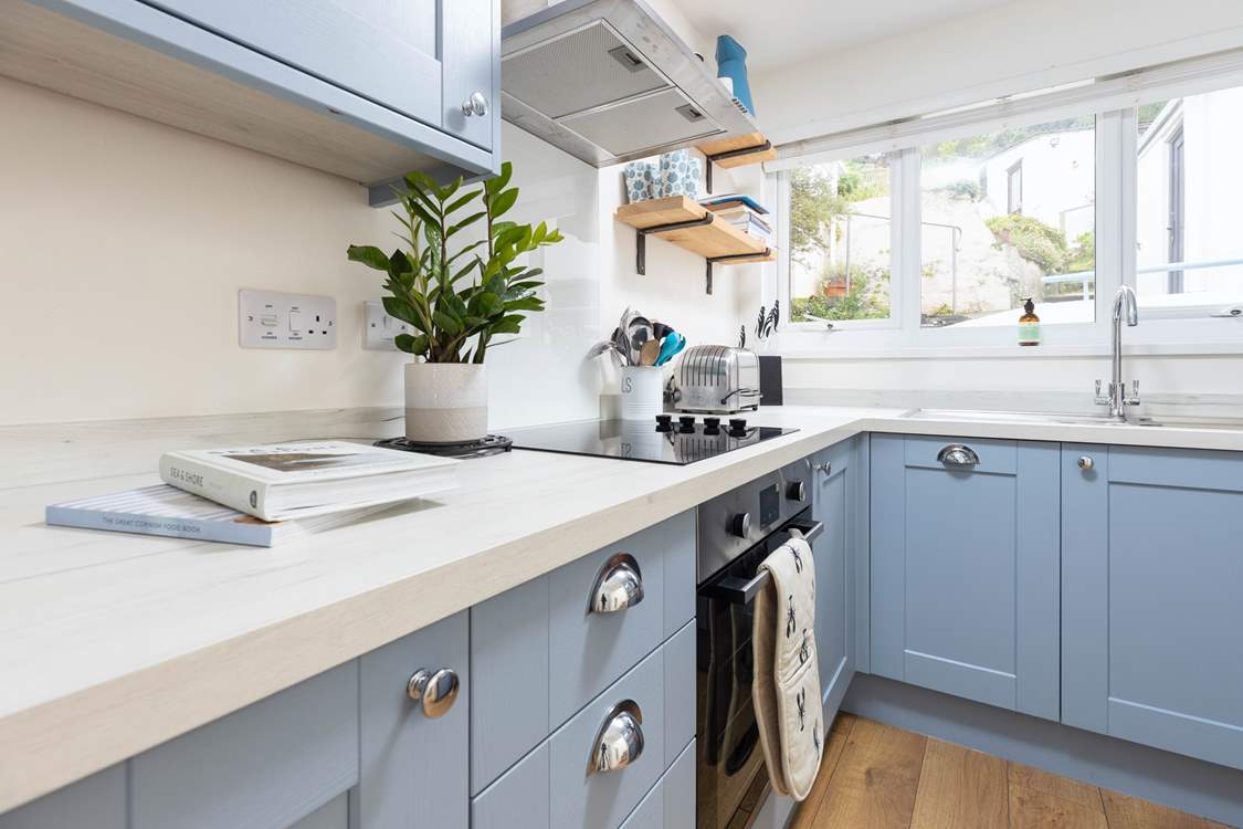 Cook a culinary delight in the well-equipped kitchen.