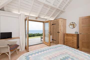 French doors open onto the terrace, you can lie in bed with a cup of tea and breathe in the sea air.