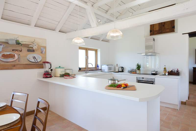 The contemporary kitchen with sea views, could be the perfect place to create a masterpiece.