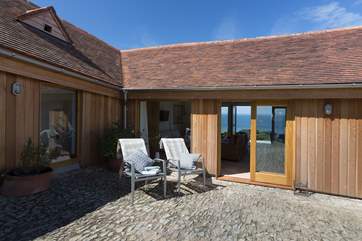 The sheltered courtyard catches the morning sun.