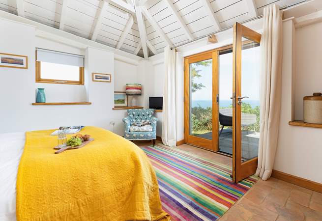 French doors in Bedroom 1 open onto the terrace, you can lie in bed with a cup of tea and breathe in the sea air.