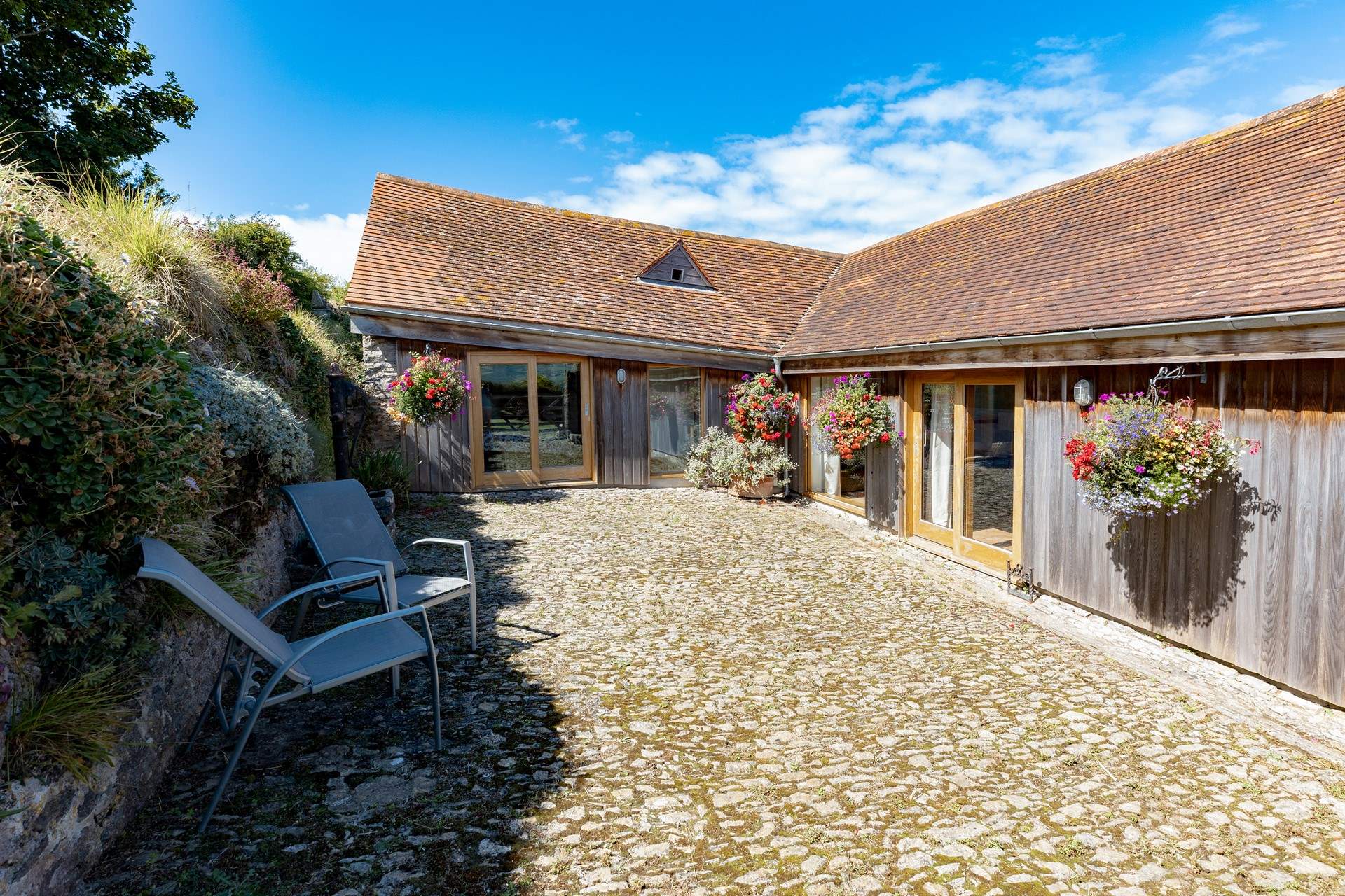 The sheltered courtyard catches the morning sun.