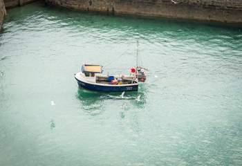 Watch the fishing boats return into harbour from the comfort of the living-room or balcony.