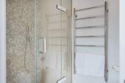 The en suite shower has a huge rose above and a mid height shower attachment too.