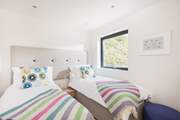 This bedroom can be made up as a king-size double bed or as twins (2ft 6'') which are more suitable for children.