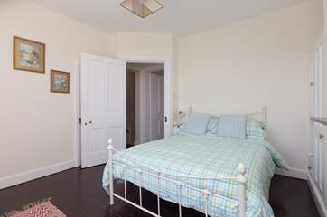 This bedroom has a tiny little en suite WC and wash basin - the door is just behind the open bedroom door in this photo.