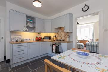 The kitchen/breakfast-room leads to the sitting-room which is at the front of the house, with wonderful sea views.