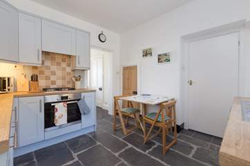 There is a very clever, and a bit quirky!, space under the stairs which is large enough for the washing machine. Note the low door, so mind your head.