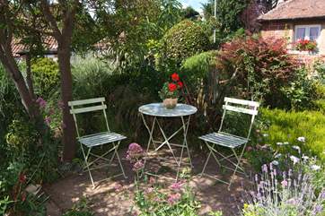 There is a very pretty sitting out area under the trees in the side garden - as well as one in the courtyard at the back of the cottage.