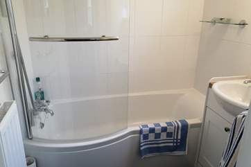 The newly refurbished bathroom. The lower than standard bath is not only easy to get into and to bathe children in but has enabled a fitted shower to be offered too.