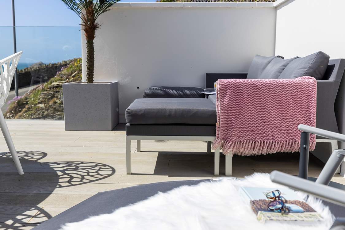 Outside seating with a wonderful view of the beach in the background.