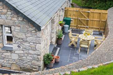 Looking down to the enclosed sun-trap courtyard from the lawn above.