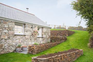 The terraced lawn at the side of the cottage.