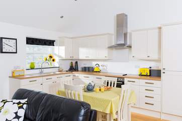 The dining and kitchen areas.