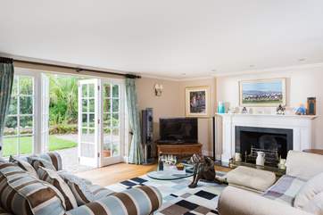 This sitting-room has doors out to the lawns and grounds.
