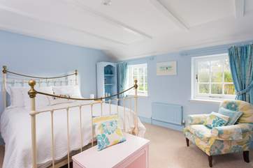 Bedroom 4 has a lovely Victorian-style bedstead.