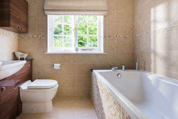 The family bathroom has an extra wide bath.