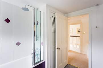 Bathroom 1 has a fitted shower over the bath.
