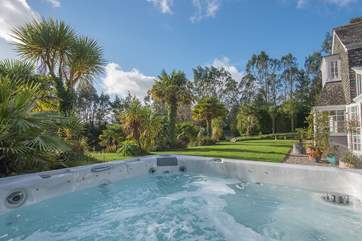 Gaze out over the garden and pond from the hot tub.