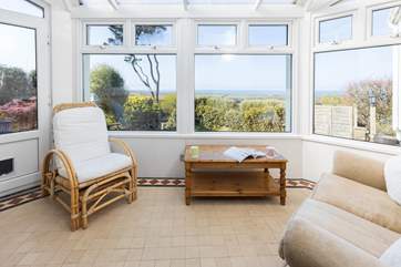 The sun-room is perfect for admiring the panoramic sea views.