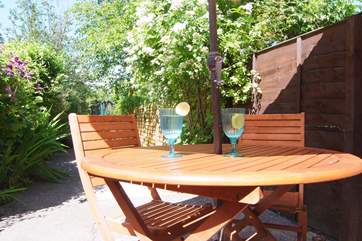 The patio outside the back door catches plenty of sunshine.
