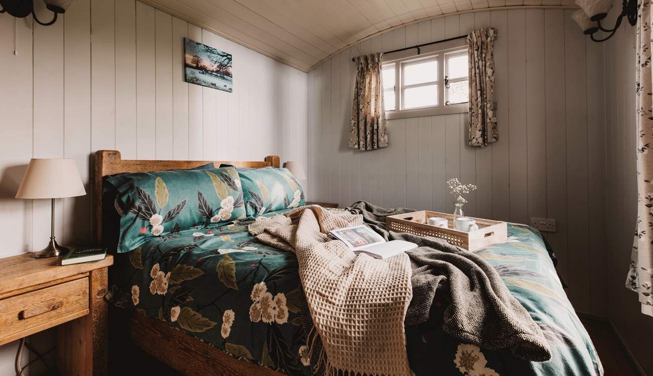 Warm and welcoming, the beautifully furnished main bedroom hosts a sumptuous double bed. 