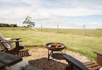 As the evening sun drops, get cosy around the fire-pit.