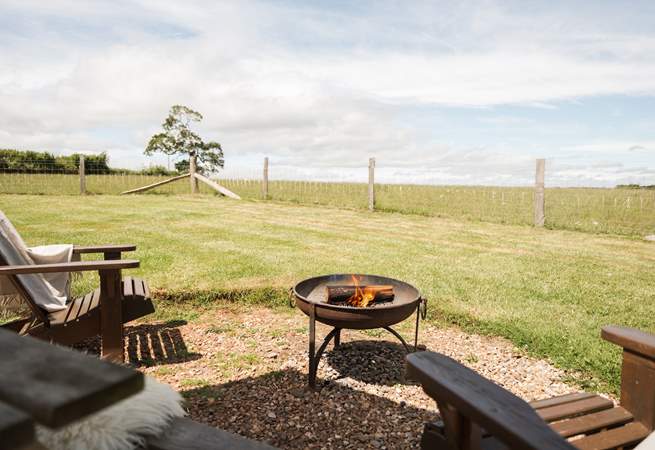 As the evening sun drops, get cosy around the fire-pit.